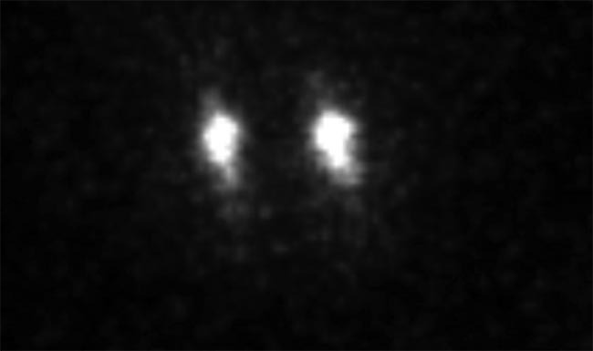 Figure 1. Individual trapped ions acquired with an electron-multiplying intensified CCD (emICCD) camera. Courtesy of Ferdinand Schmidt-Kaler, Kilian Singer, Johannes Rossnagel, and Georg Jacob/Institute of Physics, Mainz University.