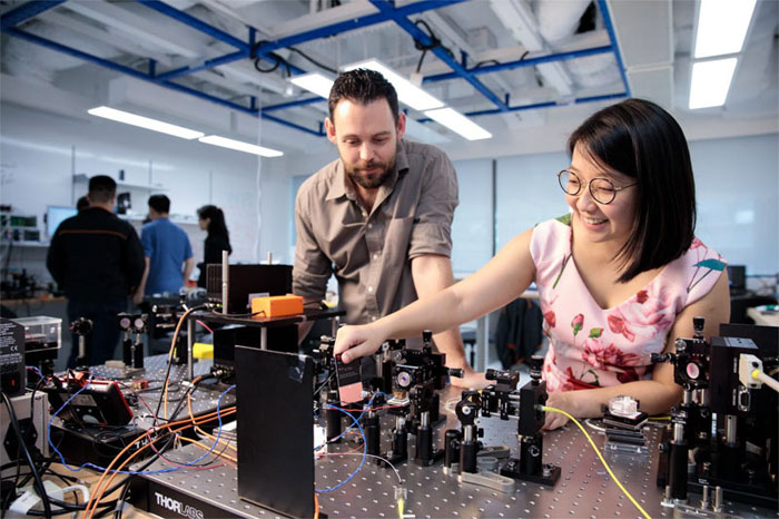 Senior research fellow James Grieve of the Centre for Quantum Technologies at NUS and Amelia Tan, senior R&D researcher of Trustwave, Singtel’s cyber-security subsidiary. Courtesy of the National University of Singapore.