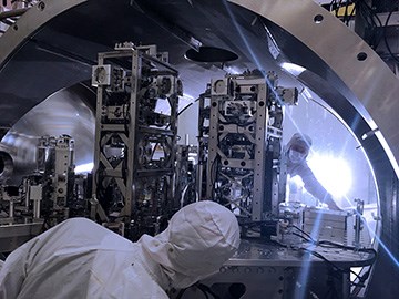Engineers install hardware upgrades inside the vacuum system of the detector at LIGO’s Washington site. (Credit: Jeff Kissel/LIGO/Caltech/MIT)