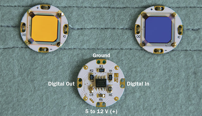 Figure 2. O-BUTTONs, front and back, with a color-tunable OLED module. Courtesy of Fraunhofer FEP.