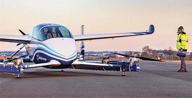 Figure 4. The Passenger Air Vehicle (PAV) flying taxi prototype by Aurora Flight Sciences demonstrated its vertical takeoff and landing capabilities in January in Virginia, with a dummy pilot in the cockpit. Courtesy of Boeing. 