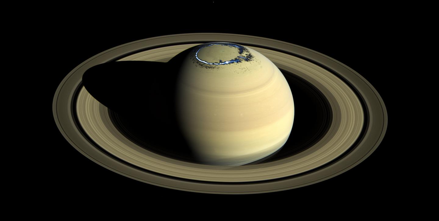 Composite of a true color image of Saturn, observed by Cassini in 2016, overlaid with a false color representation of the ultraviolet aurora in the northern hemisphere as observed on Aug. 20, 2017. Courtesy of NASA/JPL-Caltech/Space Science Institute/A. Bader (Lancaster University).
