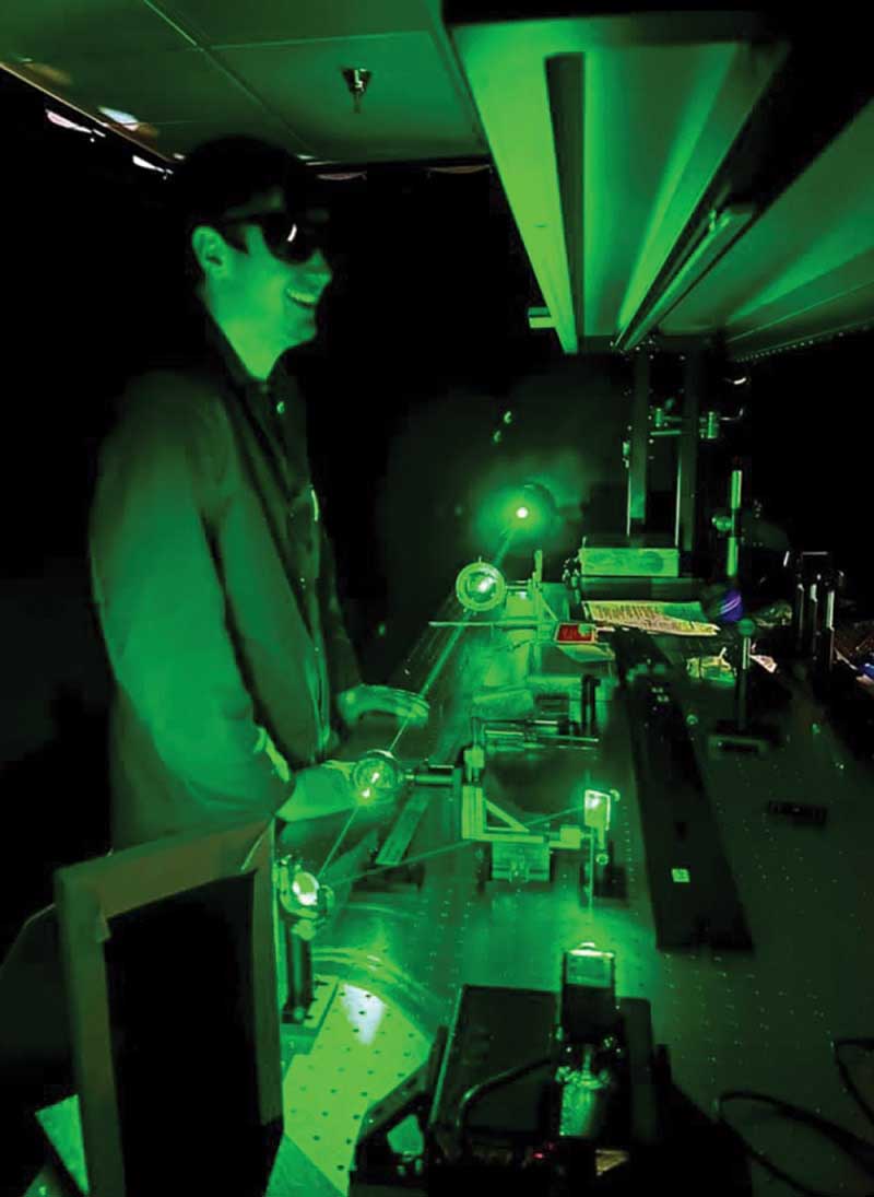 An IHCC student sets up a Class 1 laser experiment. Courtesy of LASER-TEC.
