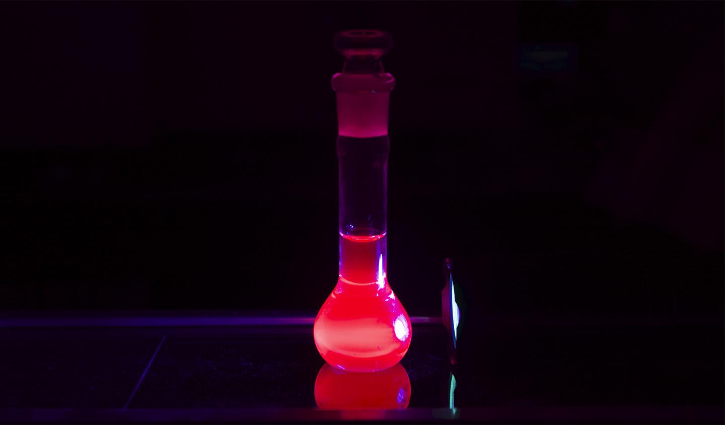 The europium Eu(III) complex with nanocarbon antenna emitting fine red light. Courtesy of WPI-ICReDD, Hokkaido University.