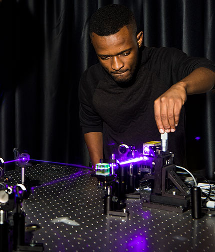 Wits researcher Isaac Nape aligns a quantum entanglement experiment. Courtesy of Wits University.