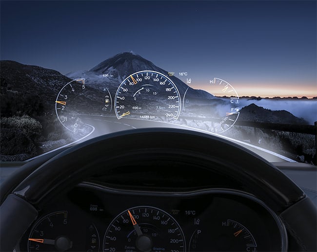 Head-up displays can be produced exclusively with a freeform surface. These displays project a straight image onto a curved glass surface, which means that the distortion of the curved projection surface in the lens of the head-up display must be anticipated so it can be precisely canceled out from the perspective of the viewer. Courtesy of Getty Images/Mike Mareen.