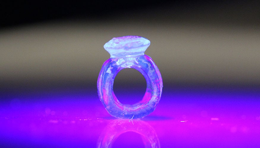 Using a custom volumetric additive manufacturing 3D printer, Lawrence Livermore researchers were able to build tough and strong, as well as stretchable and flexible, objects nearly instantly from a class of materials known as thiol-ene resins. Courtesy of Maxim Shusteff/LLNL.
