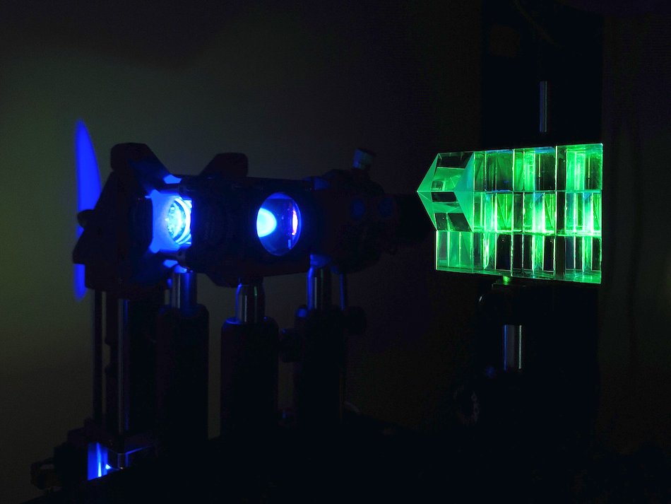 A z-splitter prism (right) produces several images, each focused to a different depth in the sample, in a single camera frame. Courtesy of Sheng Xiao/Boston University.