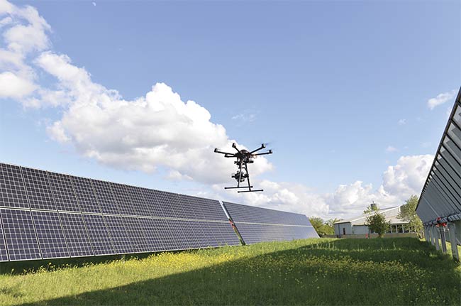  Equipped with a camera that captures images in the SWIR, a drone inspects solar panels in bright sunlight. Courtesy of Gisele Benatto and Peter Poulsen/DTU.