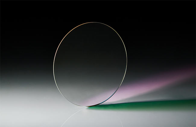 Interference coatings enable safety glasses that offer broad visible light transmission with attenuation at selective wavelengths. While fused silica is an optimal choice for the starting surface, borosilicate glass can provide the same desired properties at a much lower price. Courtesy of Hind High Vacuum Co. Pvt. Ltd.