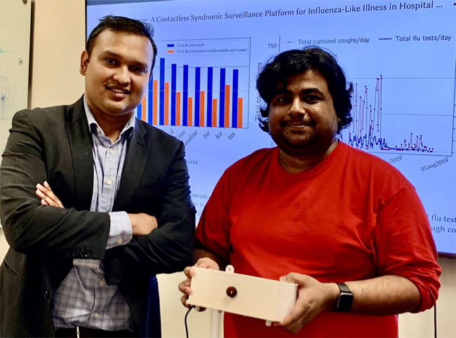 Tauhidur Rahman, (l), and Forsad Al Hossain display their FluSense device. Courtesy of UMass Amherst.