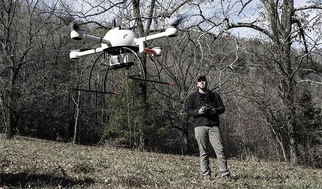 Nick Tucker of Crafton Tull, an Arkansas-based engineering and surveying company, deploys a UAV equipped with lidar to collect data for a 3D digital data set and point cloud visualization. Courtesy of Microdrones. 