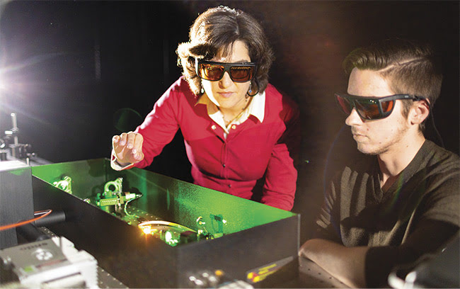 Professor Cheryl Schnitzer and Andrew Fitzgerald (Class of 2021) align a KMLabs Ti:sapphire laser. Courtesy of laser-tec.