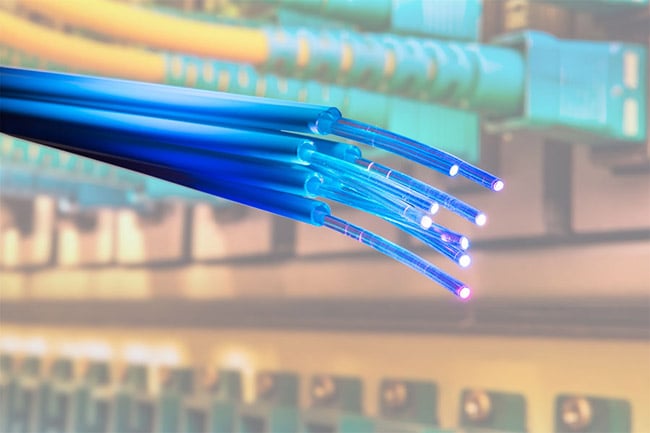 Fiber optics have been an integral part of communications in the 21st century, and serve as the backbone of 5G networks. Courtesy of iStock.com/kynny. 