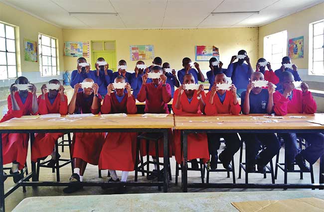 Figure 2. A microscope made of paper, the Foldscope, is helping to solve an accessibility problem in science throughout the world. Courtesy of Foldscope Instruments.