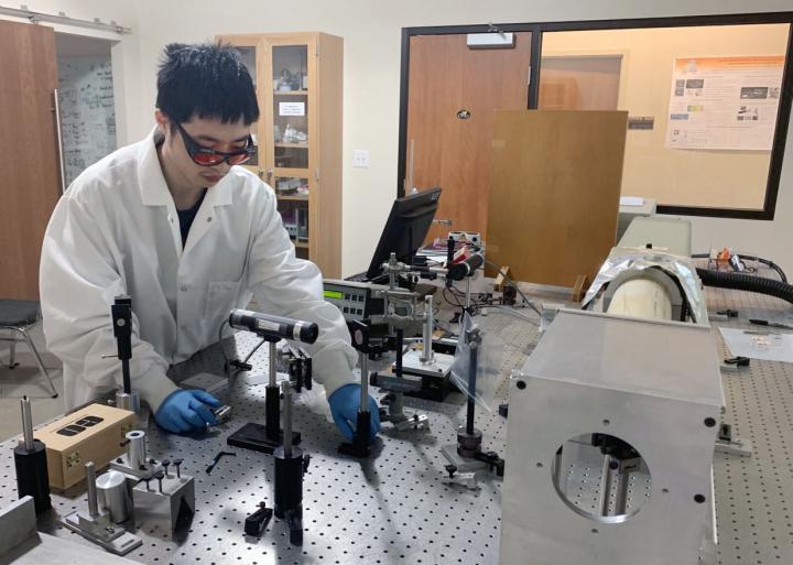 Jun Yi, a student in Clemson University's department of physics and astronomy, worked with professor Apparao Rao, researcher Exian Liu, and professor Jianbo Gao to study the correlation between the phase transition of nanocrystal perovskites and their emission properties. Courtesy of College of Science/Clemson University.
