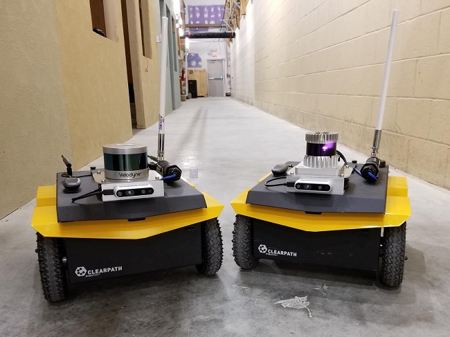 The two robots used in the experiments are identically equipped, with the exception of Velodyne VLP-16 LiDAR (left) and Ouster OS1 LiDAR (right). Courtesy of the U.S. Army.