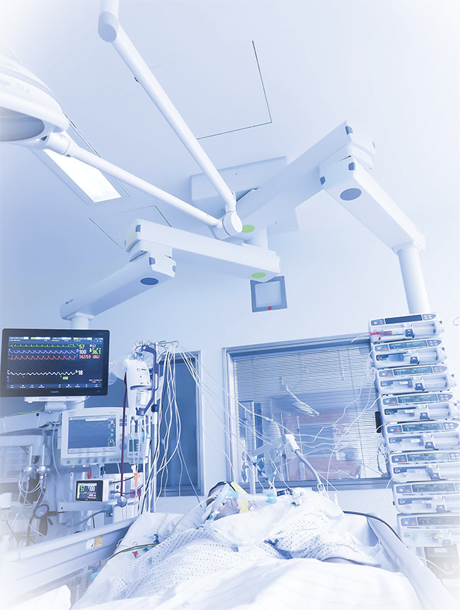 A critically ill patient in a prolonged medically induced coma. Such comas are stably maintained using a combination of anesthetics, including the inhalatory agent isoflurane, the use of which is experiencing a renaissance in hospital intensive care units. Courtesy of Michael Wenzel/Bonn University.