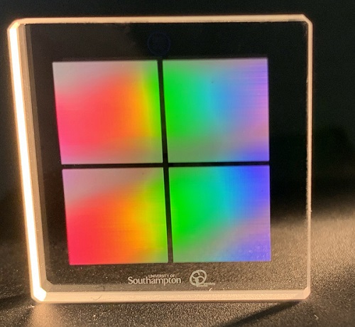 Researchers developed a new fast and energy-efficient laser-writing method for producing nanostructures in silica glass. They used the method to record 6 GB data in a one-inch silica glass sample. The four squares pictured each measure just 8.8 × 8.8 mm. They also used the laser-writing method to write the university logo and mark on the glass. Courtesy of Yuhao Lei and Peter G. Kazansky, University of Southampton.