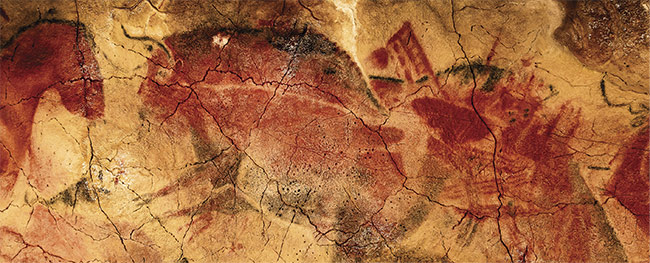 A paleolithic rock painting of a bison and a horse in the Cave of Altamira near Santillana del Mar in Cantabria, Spain. Courtesy of iStock.com/JESUSDEFUENSANTA.