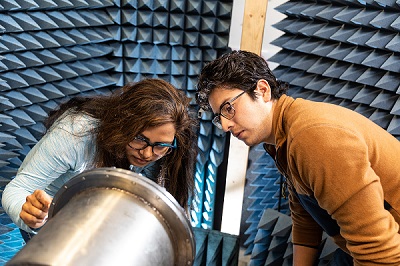Ph.D. student Khandakar Nusrat Islam (left), and Master of Science degree graduate, Braulio Martinez (right) at work in the UNM Pulsed Power, Beams and Microwaves Laboratory. Courtesy of UNM.
