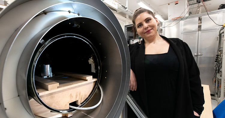 Researcher Aikaterini Gialopsou with the magnetic shield where participants’ brain signal measurements are taken. Using two types of sensors, a team at the University of Sussex showed, for the first time, that quantum sensors produce highly accurate results of brain activity in terms of both space and time. Courtesy of the University of Sussex.