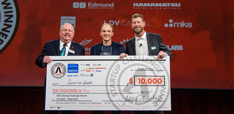 CEO of Senorics Ronny Timmreck, center, receives the first-place prize in the 2020 SPIE Startup Challenge from then-SPIE President John Greivenkamp, left, and Jenoptik Optical Systems President Jay Kumler. Courtesy of SPIE.