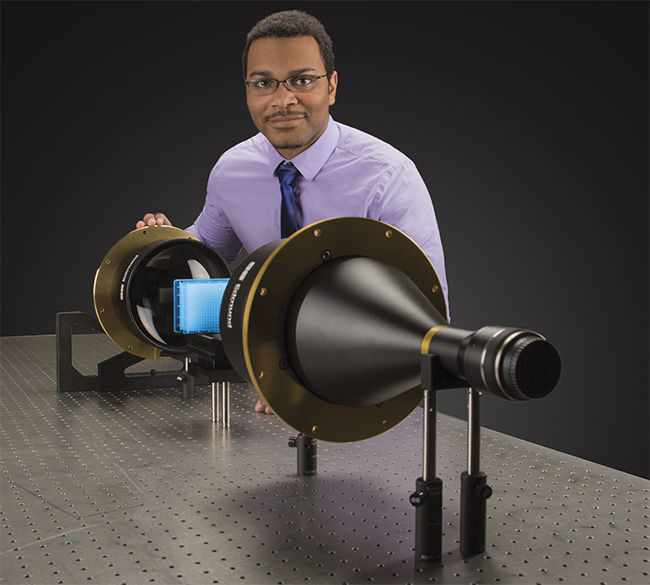 Jaylond Cotten-Martin, vision solutions engineer at Edmund Optics, pairs a telecentric lens with a telecentric backlight illuminator for high-edge-contrast imaging. Courtesy of Edmund Optics.