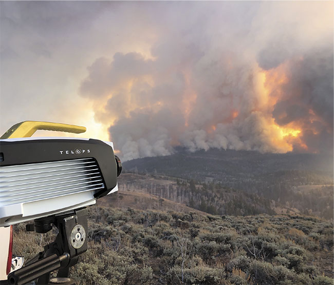 A Telops M150 camera is aimed at a U.S. Forest Service-prescribed fire in Utah in October 2019 (top). An IR image of the same burn (bottom). Courtesy of Craig Clements.