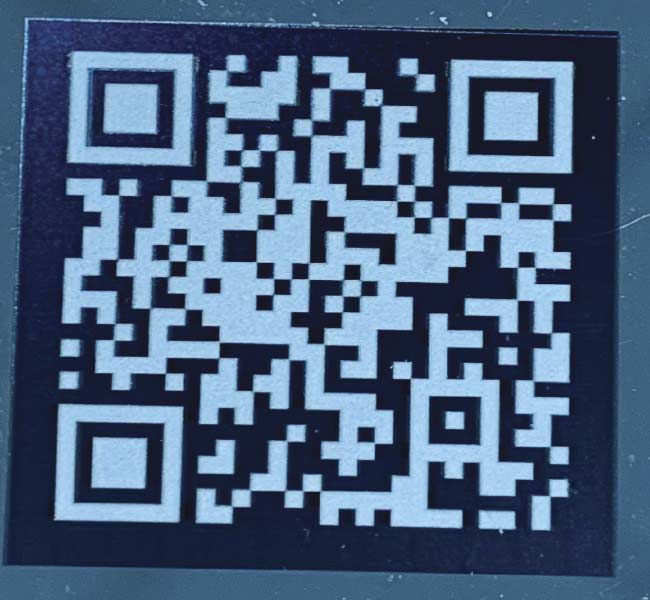 A quick response (QR) code created using a combination of black and white marking on mirror-polished stainless steel to enhance contrast. Lasers typically mark stainless steel via a controlled localized heating of the surface to temperatures that promote oxide growth, and it is this oxide that produces the high-contrast mark. Courtesy of TRUMPF.