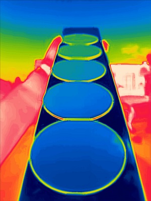 Silicon wafers coated with the gradient ENZ materials viewed through a thermal imaging camera. Courtesy of Raman Laboratory/UCLA.