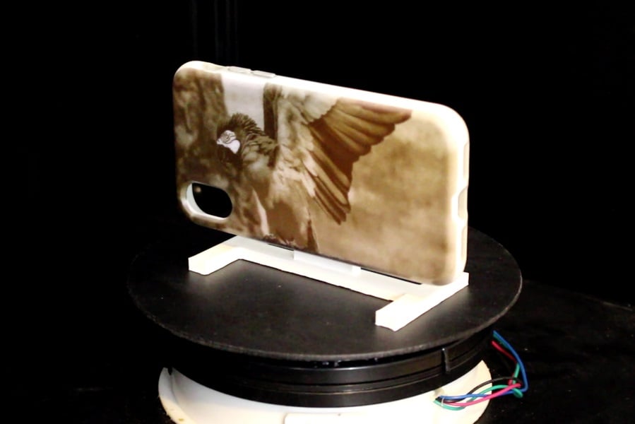 A new system uses UV light projected onto objects coated with light-activated dye, such as this previously pink phone case, to alter the reflective properties of the dye, creating images in minutes. Courtesy of Michael Wessley, Stefanie Mueller, et al.