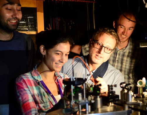 University of Queensland team researchers (counter-clockwise from bottom-left) Caxtere Casacio, Warwick Bowen, Lars Madsen and Waleed Muhammad aligning the quantum microscope. Courtesy of The University of Queensland.