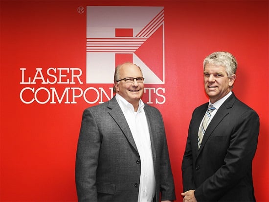 Gary Hayes, left, hands over management of LASER COMPENENTS USA to Matthew Robinson. Courtesy of LASER COMPONENTS.
