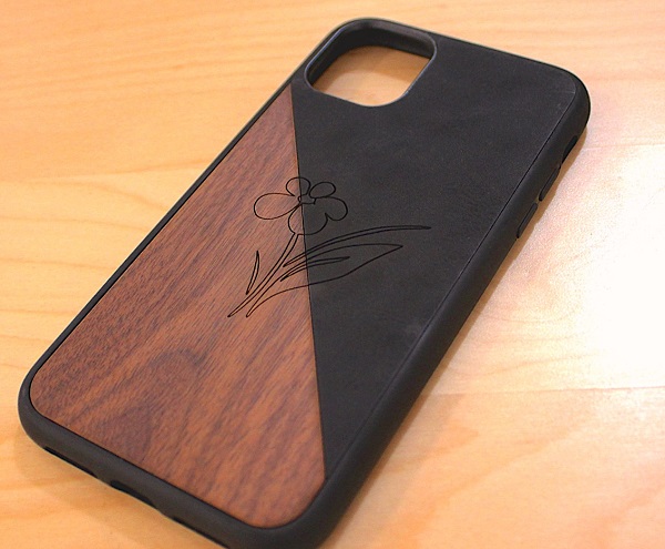 A phone case comprised of two different materials engraved using the SensiCut system. Courtesy of Mustafa Doga Dogan, MIT.