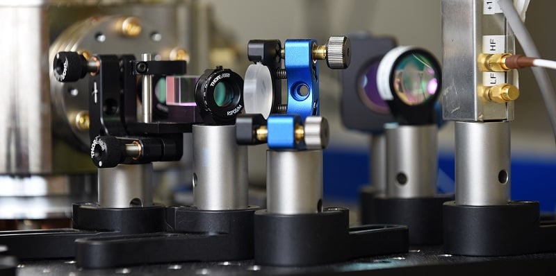 Close-up of the optical components used to stabilize the light of the infrared laser for the precise reference frequency. Courtesy of METAS.