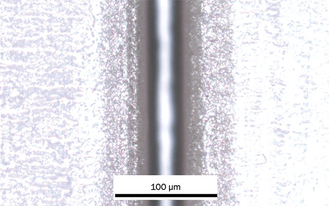 Figure 6. A full cut in a 45- to 50-µm-thick bare liquid-crystal-polymer sheet material with a single pass at a 1-m/s scan speed. Courtesy of MKS Instruments.