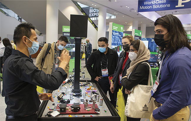An exhibitor at the 2022 SPIE BiOS Expo discusses the components used in his company’s optical systems. Courtesy of SPIE.