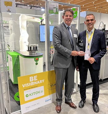 Corey Merchant, left, and Christoph Hofbeck of Kitov.ai celebrate their 2022 VISION Award at their booth at VISION. Courtesy of Kitov.ai.