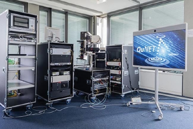 Figure 1. In 2021, two German ministries used the equipment from the QuNET project to establish a quantum secured video conference. The quantum key was exchanged via fiber and two free-space channels. Courtesy of Fraunhofer IOF.
