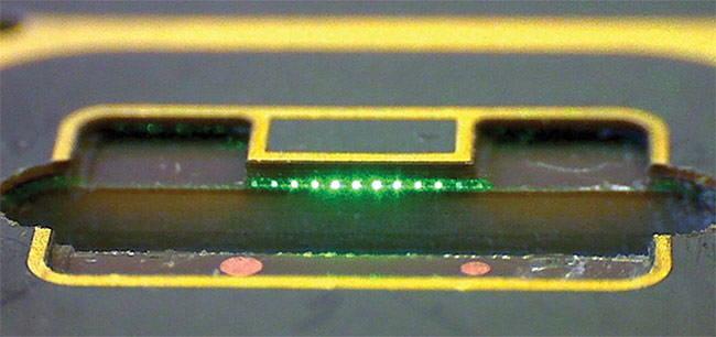 In contrast to in-plane coupling, in which fibers are directly edge-coupled to waveguide facets, vertical coupling requires an element to steer light at a 90° angle. This element can either be integrated into the transceiver chip or placed into a cavity on the board. Courtesy of vario-optics AG.