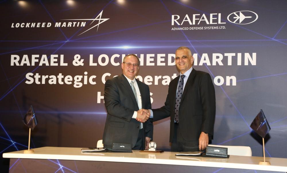 Lockheed Martin COO Frank St. John, left, shakes hands with Yoav Har-Even, Rafael President and CEO. Courtesy of Lockheed Martin.