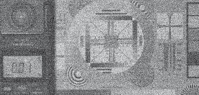 Figure 2. A low-light imaging comparison of an image captured using Gigajot’s GJ01611 QIS detector with 16.7-MP resolution and 1.1-µm pixel size (top) and an image captured using a state-of-the-art CMOS image sensor with 6.4-MP resolution and 2.4-µm pixel size (bottom). Images were captured under 10-mLux illumination with 40-msec exposure time through an f/1.4 lens. Both images show raw data without image enhancement. Though the QIS detector’s pixels are 4.8× smaller, its photon-counting read noise still delivers improved low-light imaging performance compared to the CMOS sensor. Courtesy of Gigajot Technology.