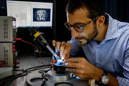 Matteo Seita, assistant professor at NTU, analyzing a piece of 3D printed alloy for strength and hardness using a prototype imaging system. Courtesy of NTU Singapore.