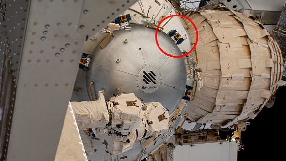 SEAQUE will be hosted on the International Space Station by the Nanoracks Bishop airlock. The blue-and-gold brackets attached to the side of the airlock are for external payloads. The technology demonstration will be installed at one of those sites. Courtesy of NASA.
