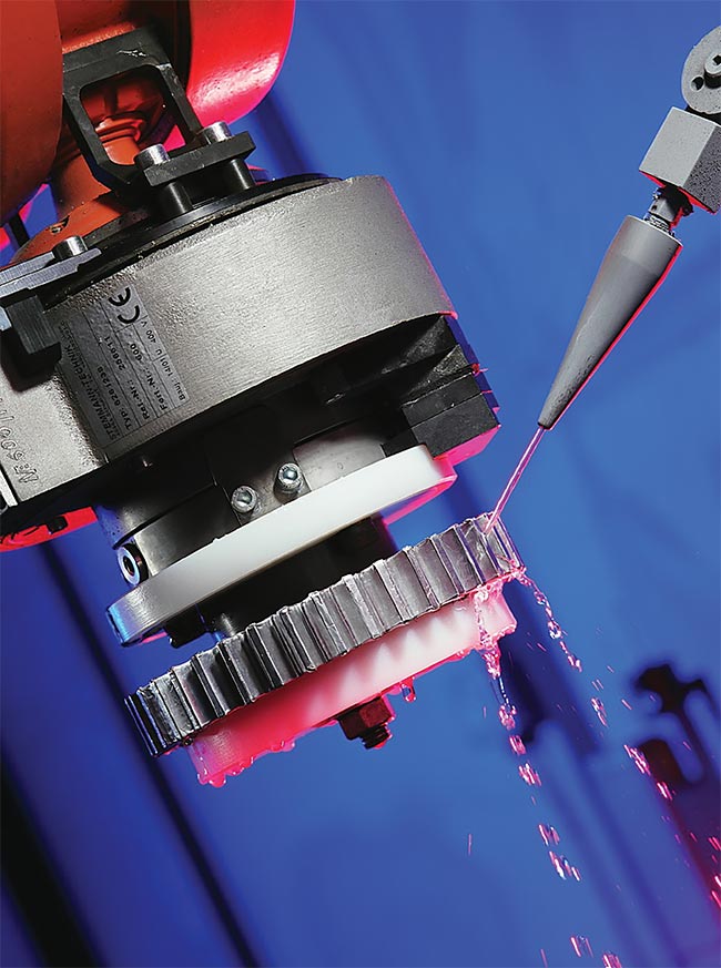 A thin flow of water confines laser-generated plasma at the component’s surface, pushing as much energy into the material as possible. Courtesy of Curtiss-Wright.