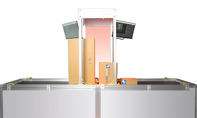 Figure 2. In logistical distribution centers, vision systems are mounted within tunnel structures through which packages pass on conveyor lines. Because packages can vary widely in size and orientation, adaptive lighting and autofocus cameras are often used to accurately image details at various distances from the camera. Courtesy of Smart Vision Lights.