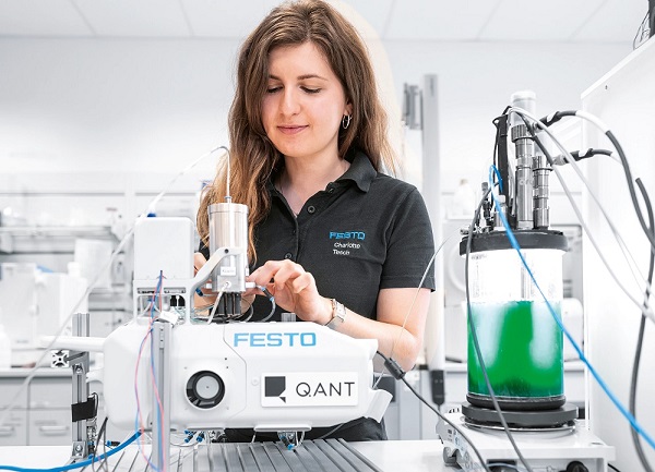A Festo engineer connects the microfluidic pumps that deliver the algae fluid to the Q.ANT sensor. Courtesy of TRUMPF. 