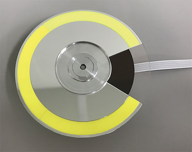 Figure 3. A phosphor wheel that spins to distribute photon and thermal load over a large area of the phosphor. Courtesy of Faiz Rahman.