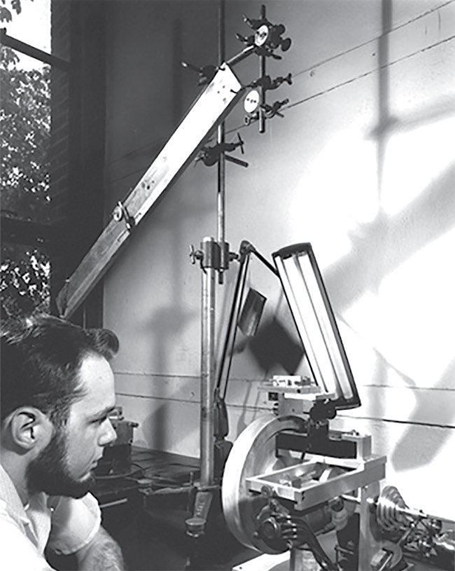 Figure 1. Larry Curtis of the University of Michigan draws the first optical clad fiber by the rod-in-tube method, for use in a medical endoscope. Courtesy of Abraham Katzir.